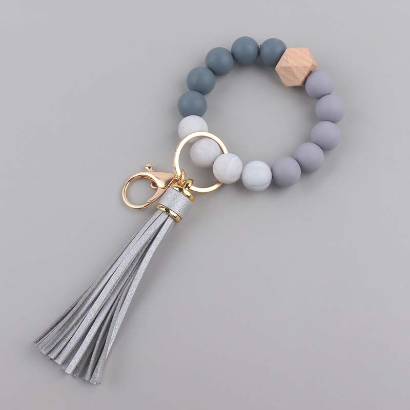 Nuevo cuero creativo pu borla colgante silicona muñeca llavero colgante silicona cuentas pulsera llavero