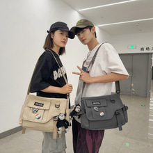 新款斜挎包男士潮牌日系工装挎包帆布学生邮差包女百搭休闲单肩包