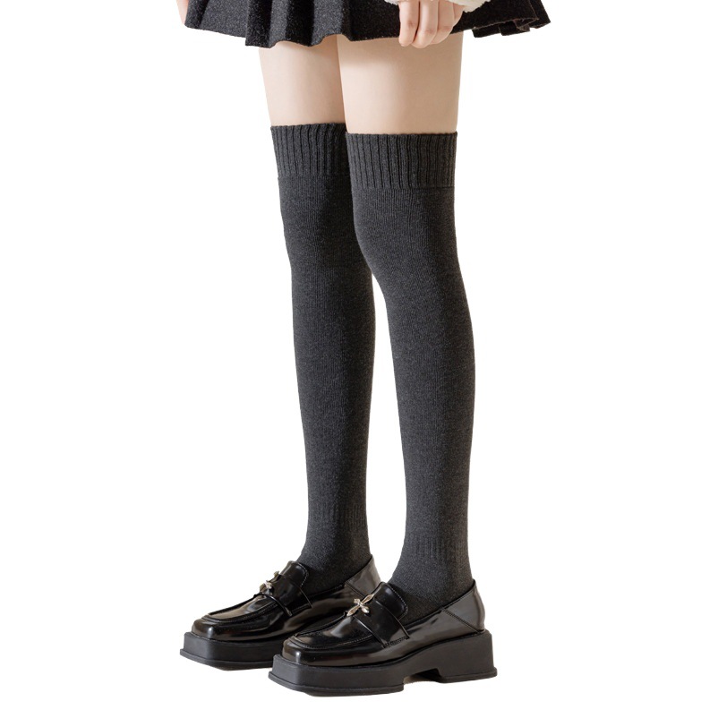Calcetines de becerro de las mujeres Otoño e Invierno forrado de lana gruesa medias calientes color sólido Terry sobre la rodilla calcetines Zhuji calcetines al por mayor