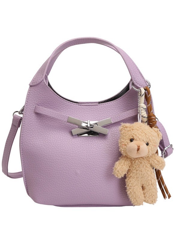 Un sentimiento de alto nivel de oso colgante bolso de cubo portátil para mujeres 2026 nuevo litchi nicho viaje mochila de hombro