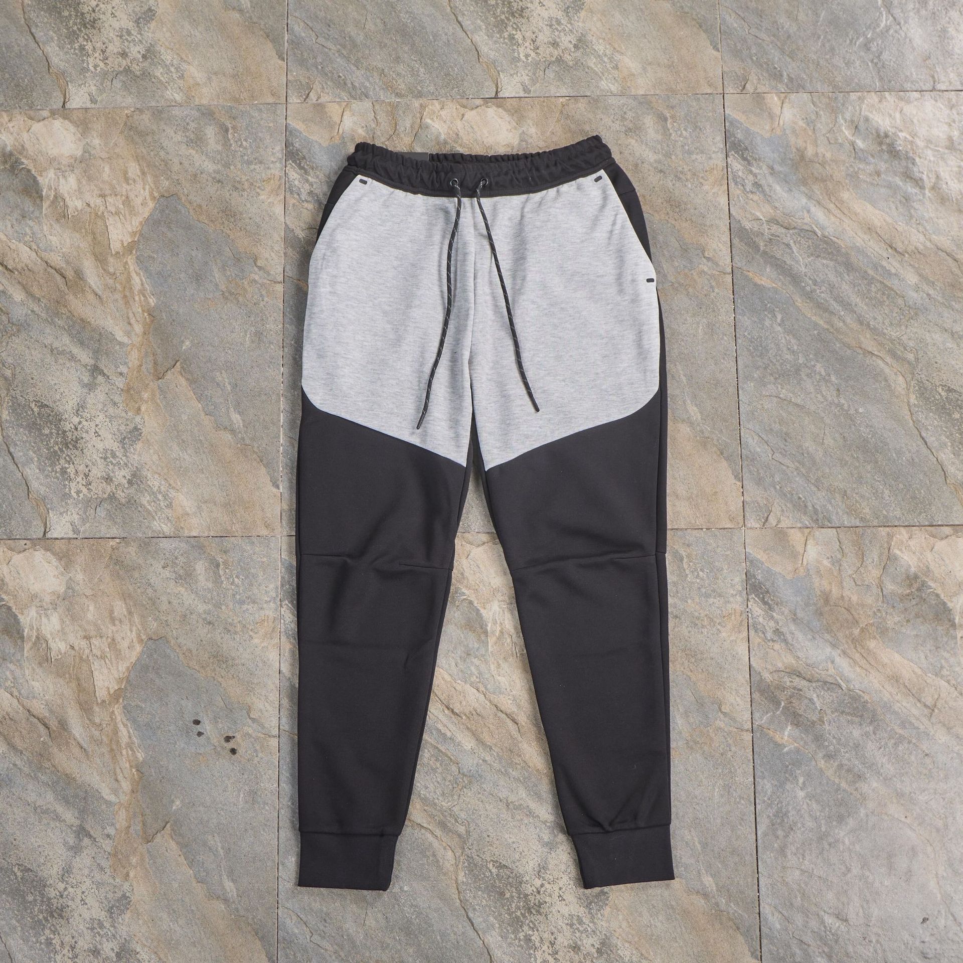 Pantalones casuales deportivos primavera y otoño aire laminado de algodón con cremallera pantalones deportivos para hombres y mujeres