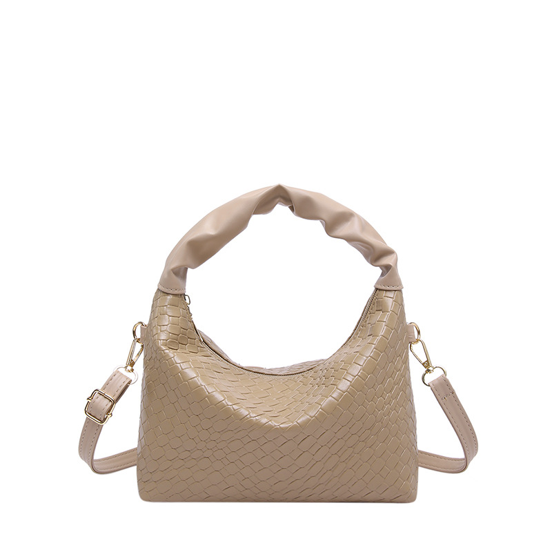 Este año bolsos populares de mujer diseño de tejido bolsos de mochila coreanos bolsos de transporte de aire extranjero 2024 nueva moda bolsos de hombro