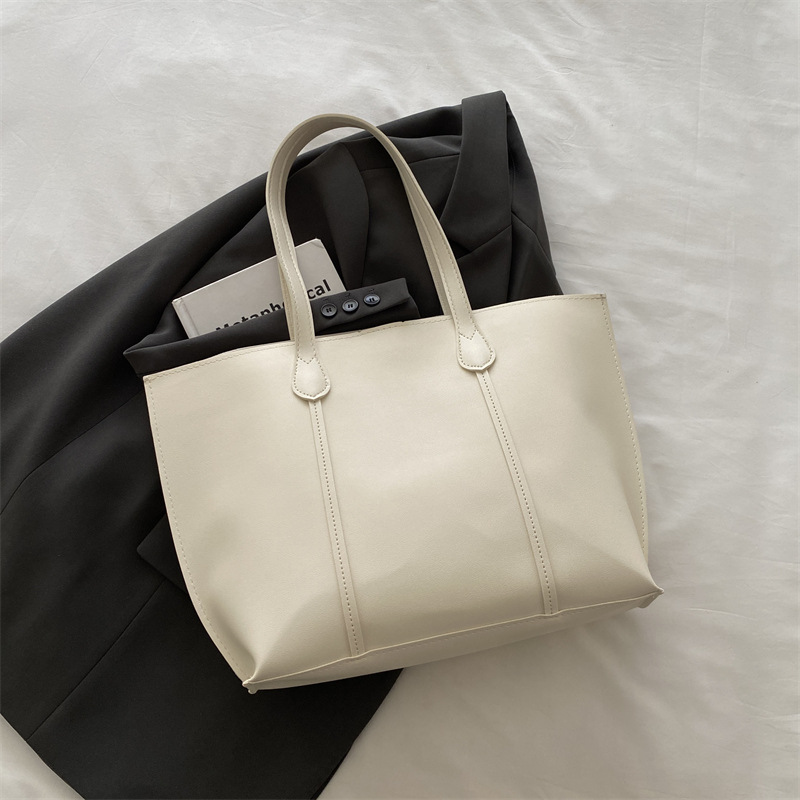 Bolsa coreana de gran capacidad de color sólido para mujeres 2024 nueva moda retro bolso de viaje simple bolso de hombro sólido