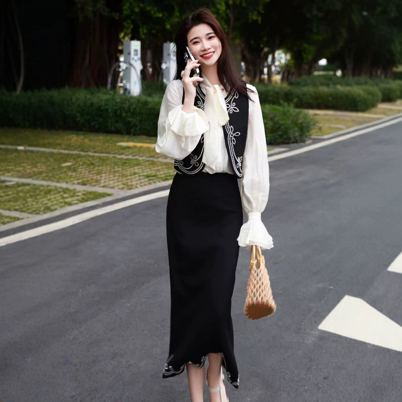 Early autumn commuting set: ruffled collar shirt, heavy beaded vest, and skirt. Women's embroidered elegant workplace three-piece set