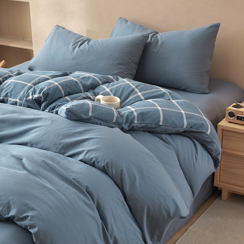 Nuevo traje de cama de algodón lavado de algodón de cuatro piezas de algodón 2025 nuevo traje de dormitorio de funda de edredón de sábana simple de tres piezas