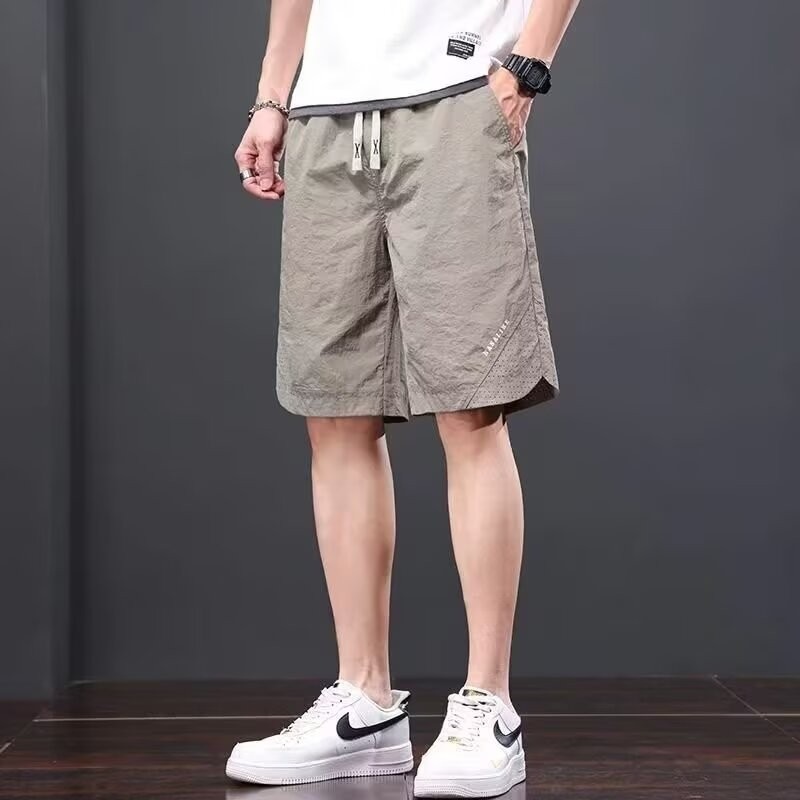 Camisas, menos ropa, pantalones de verano de cinco puntos, holgados y cómodos, todo-fósforo, pantalones casuales de estilo de Hong Kong, deportes para hombres, hombres estadounidenses, de secado rápido