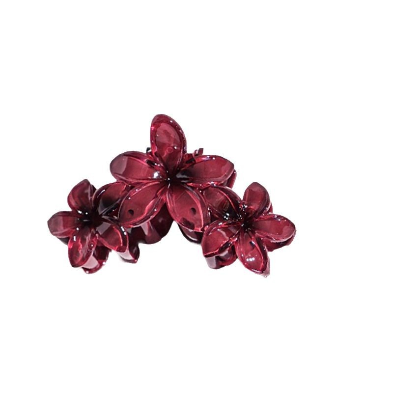Elegant hårklämma med bordeauxfärgad plumeriablomma_voghion.com