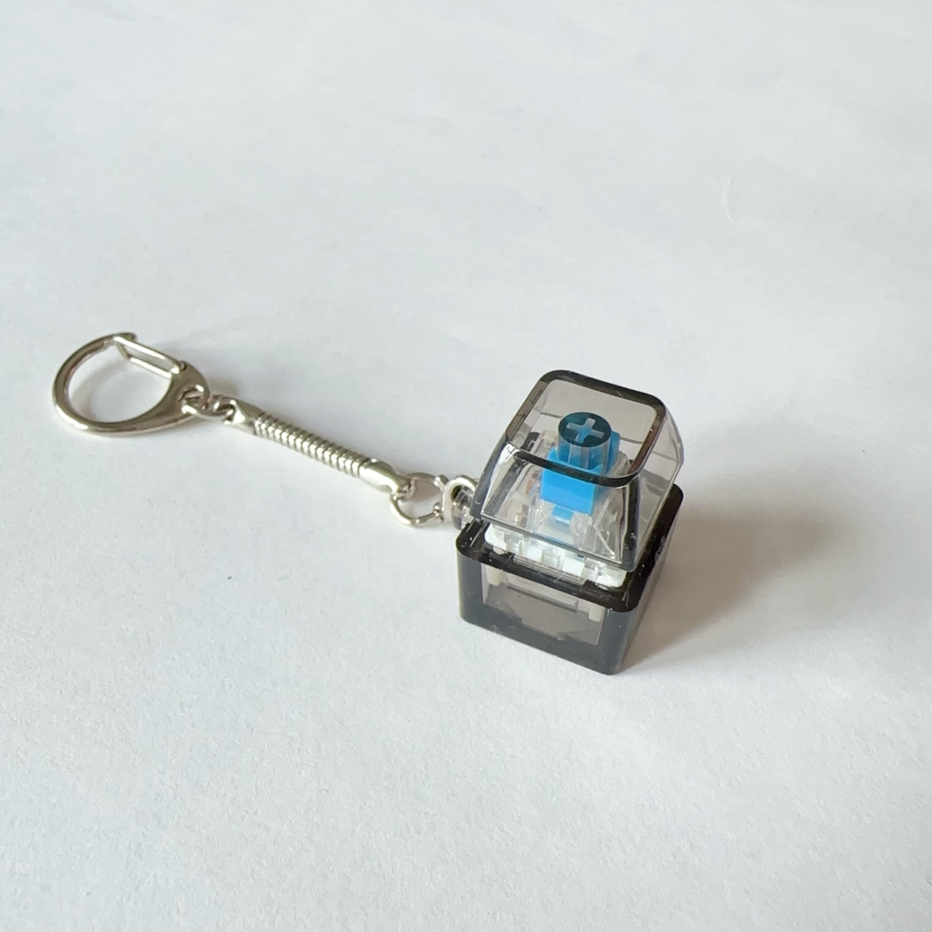Pc single button-black transparent-snake bone chain