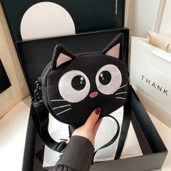 漫画のショルダーバッグの新型のかわいい大きい目の小さい黒猫の斜めのショルダーバッグの女性のファッションの百合の学生は小銭入れのカバンを収納します。