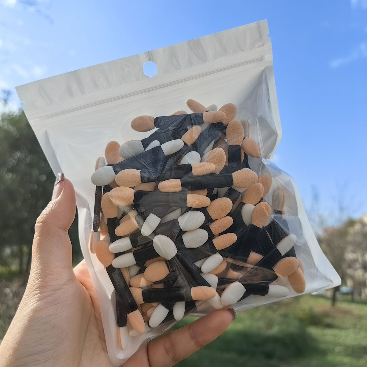 5.5cm黑杆肤白棉100支袋装