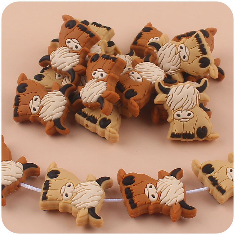 Bebé suministros de dibujos animados de silicona vaca mordedor creativo DIY bebé molar pezón cadena anti-gota cadena accesorios pequeños