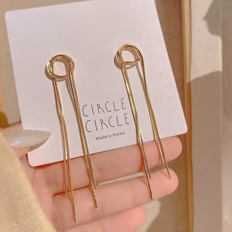 Retro creative golden copper long earrings