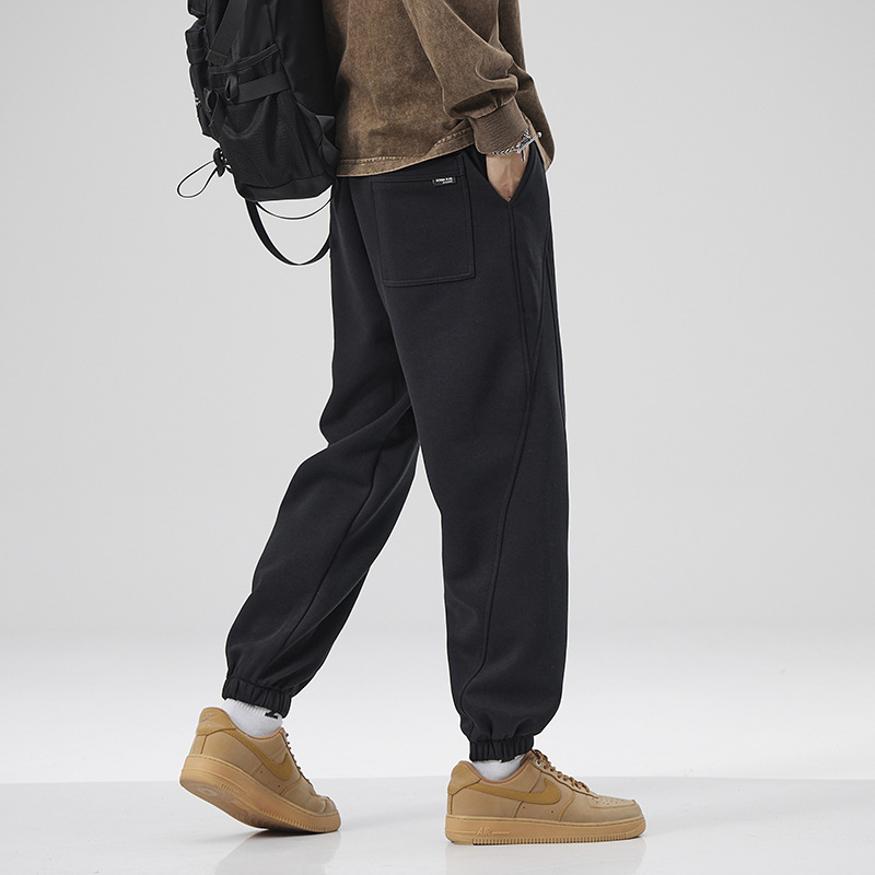 2025 otoño y invierno pantalones negros de pie pantalones deportivos largos lar