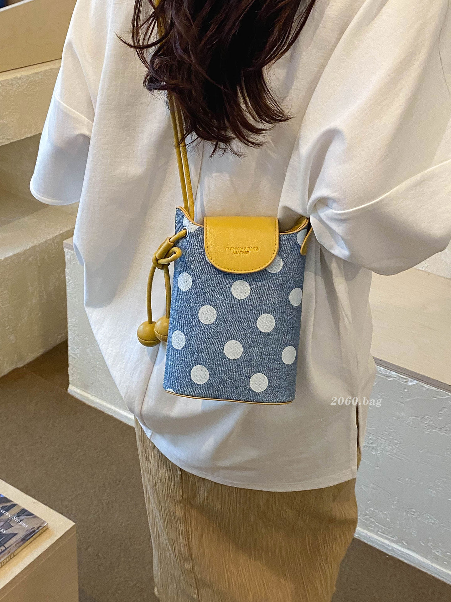 Un hombro de moda de viaje nuevo punto de onda bolso superfuego bolso de mochila para mujeres verano 2026 sensación coreana