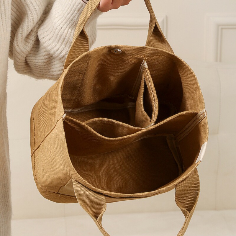 Canvas Bag for Women 2025 New Handbag with Multiple Compartments for Work and Commuting, Large Capacity for Going Out and Carrying Baby, Hand-Held Cosmetics Bag