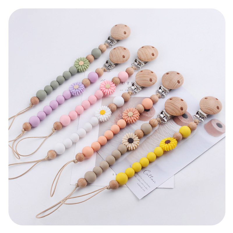 Productos para bebés de madera de haya cadena de tetas de silicona de dibujos animados margarita cuentas para calmar bebés cadena de tetas anti-caída cadena