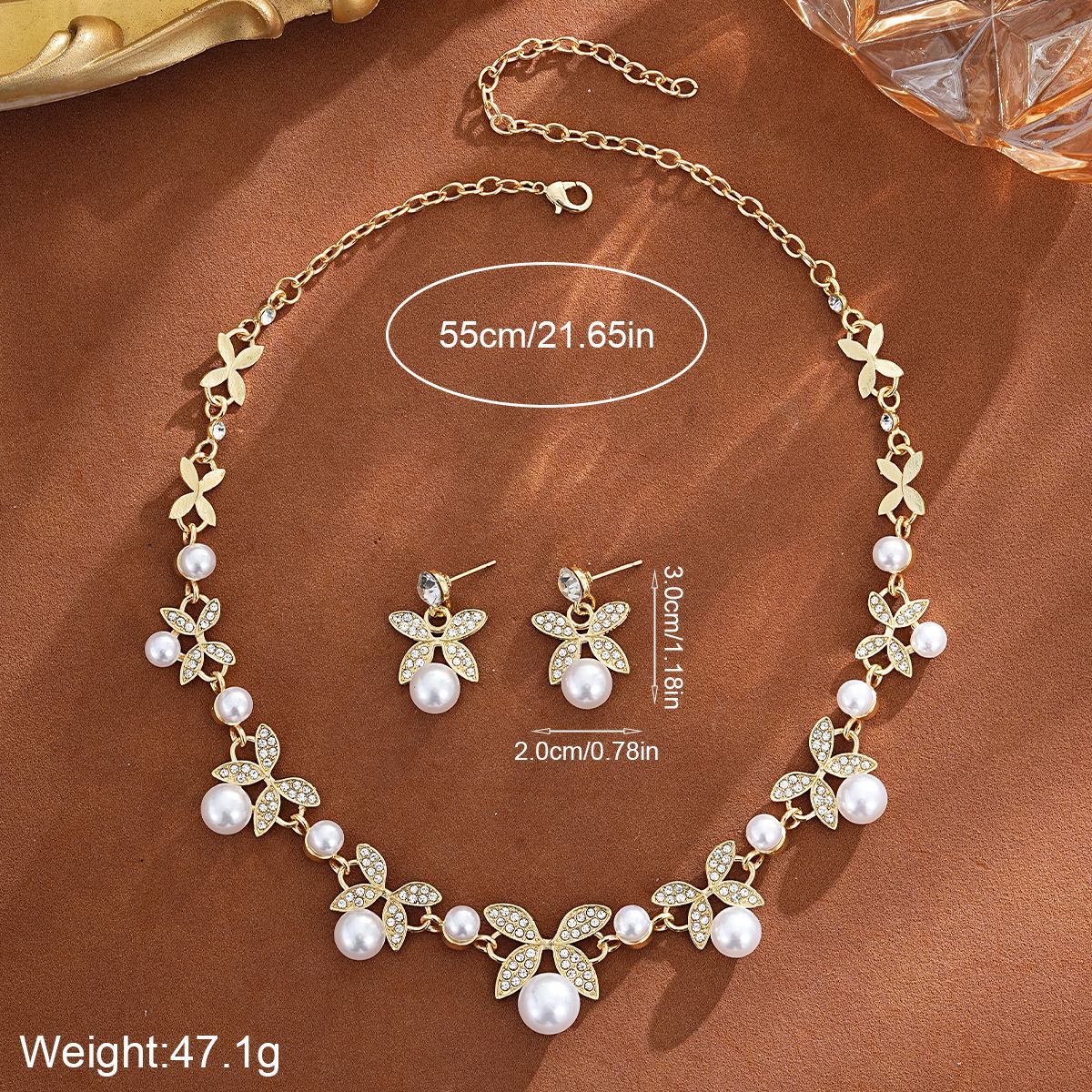Ensemble collier et boucles d'oreilles deux pièces, collection 2026, tendance transfrontalière, orné de perles et de motifs en forme de feuille. Un bijou de luxe léger et raffiné pour femme._voghion.com