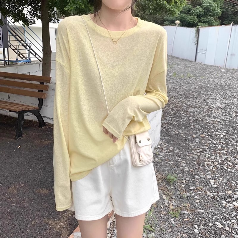 Thin, slightly sheer, sun-protective long-sleeved T-shirt for women, spring and summer, simple and relaxed style, loose round neck pullover, yellow top.