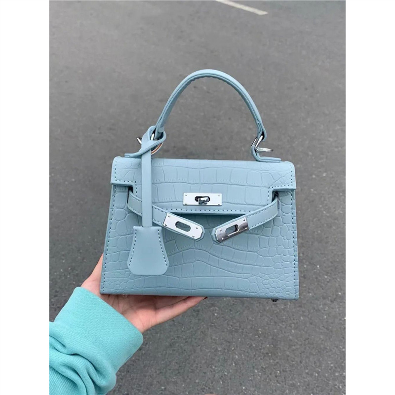 蓝色精致手提凯莉包包女式2025新款高级质感轻奢小众通勤斜挎小包