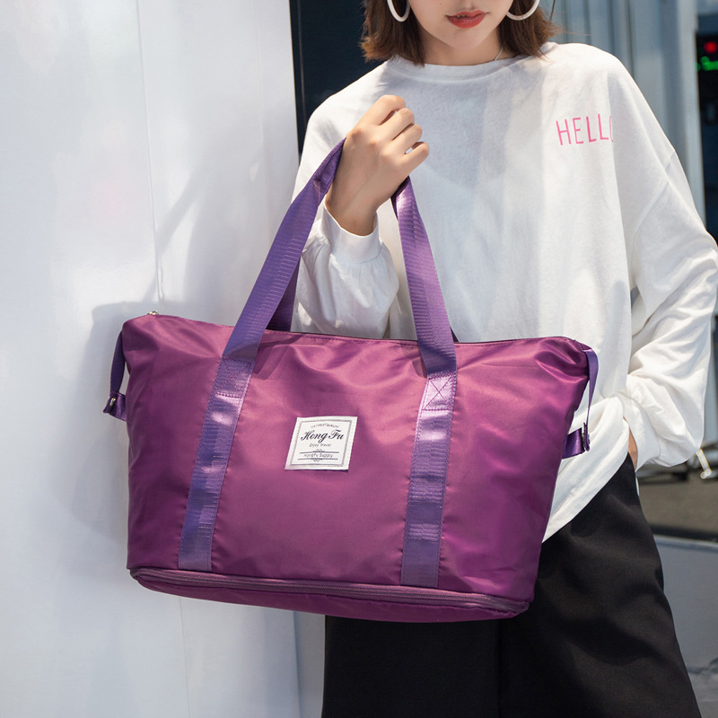 Bolsa de viaje de corta distancia portátil de gran capacidad bolsa de equipaje impermeable de moda para mujer bolsa de embarque de almacenamiento de viaje para hombres