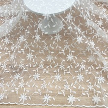 厂家批发水溶欧根纱蕾丝刺绣面料白色牛奶丝童装连衣裙家纺绣花布