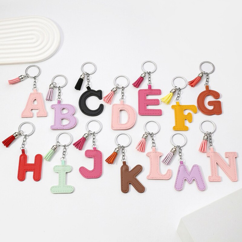 Cross-border new PU leather 26 English letter keychain color leather tassel single letter pendant pendant