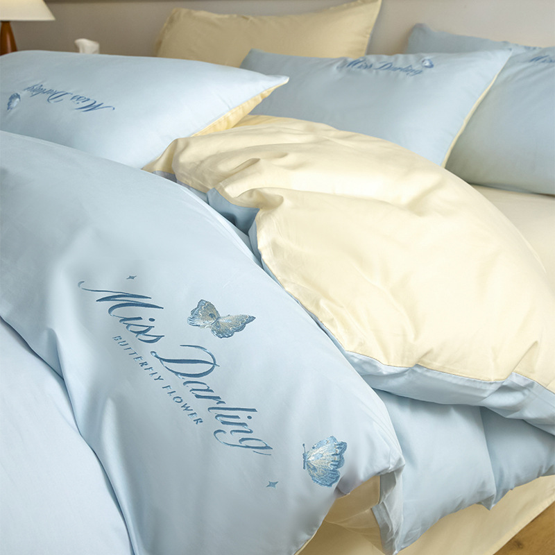 Estilo de lujo ligero 40 piezas de algodón puro traje de cuatro piezas corazón de niña bordado floral funda de edredón ropa de cama de algodón suave de alta calidad