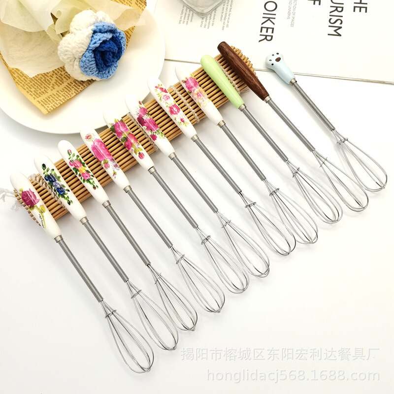 新商品の鶏の羽の木の柄のステンレスの卵を割る器は軽くて豪華な風があります。|undefined