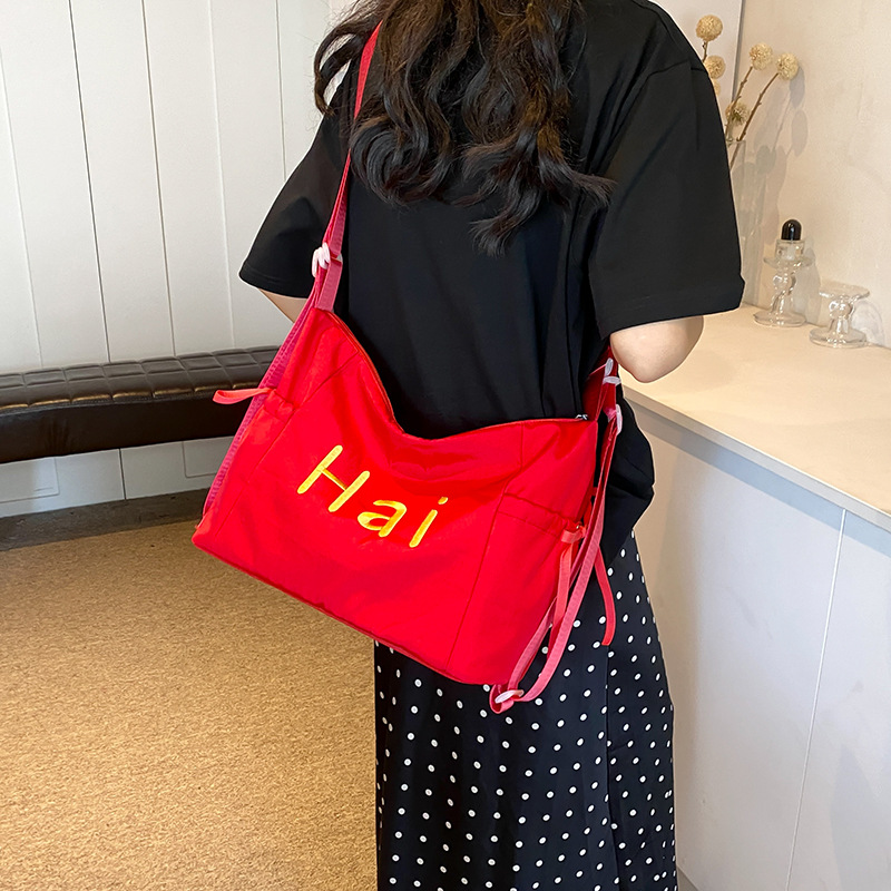 Bolsa de lienzo de letras de la escuela de verano 2024 nueva moda coreana nicho bolso tote de gran capacidad mochila