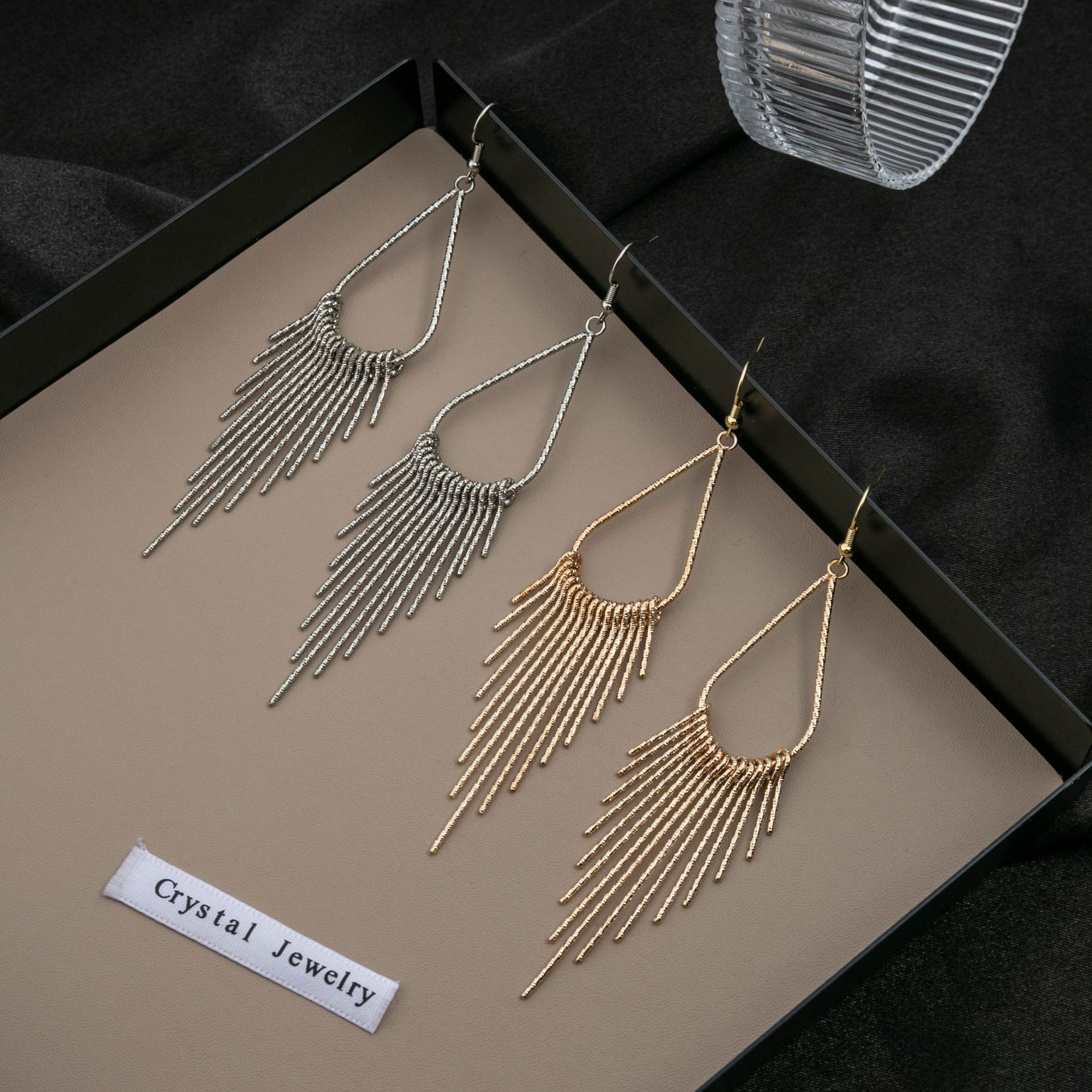fashionable earrings drop-shaped with tassels