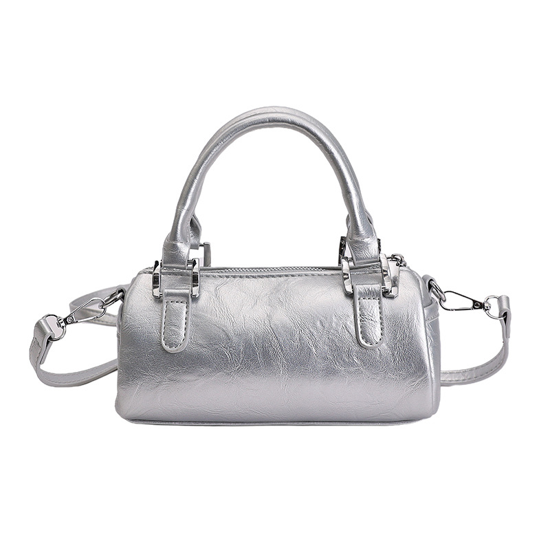 Nicho de diseño retro bolso de mano mujer 2026 primavera nuevo bolso de hombro sensación diaria de moda oblicuo bolso cilíndrico