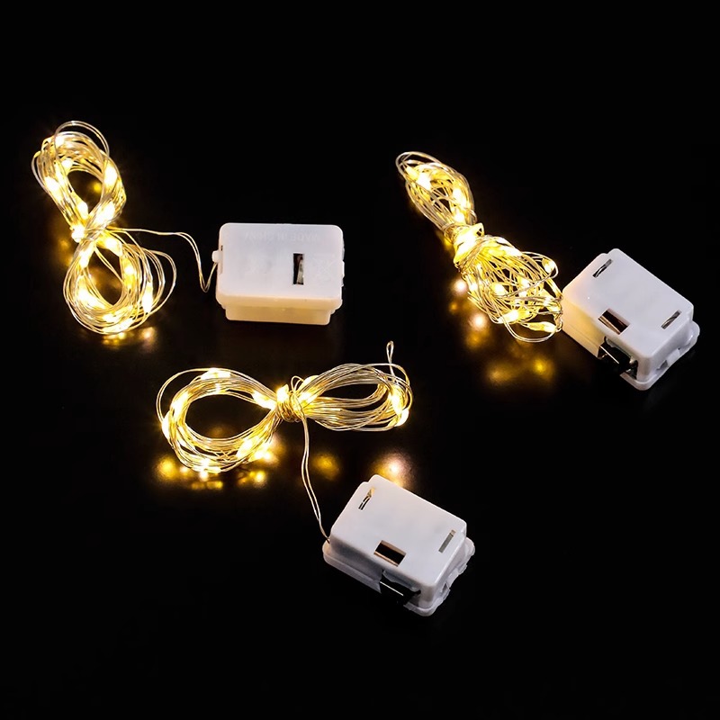 LED botón batería pequeña caja blanca flores de colores luces de cadena al por mayor árbol de Navidad decoración de alambre de cobre atmósfera luces de cadena