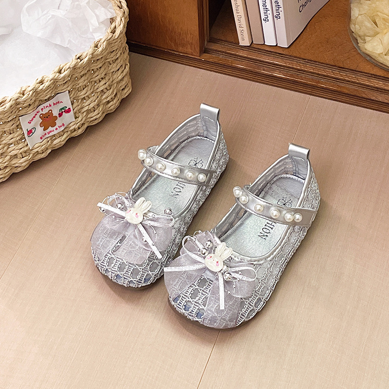 Niñas sandalias de arco de perla 2026 verano nuevo niño bolso de dibujos animados hueco princesa sandalias zapatos de playa