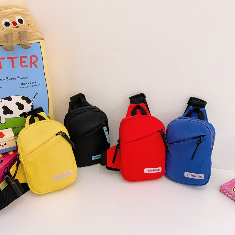 2025 nuevo bolso para niños letras de moda coreana simple color sólido bolso de mochila para niños bolso de pecho deportivo casual