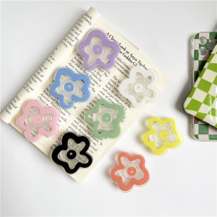 Cross-border solid color small flower air cushion bracket lazy desktop support back sticker mobile phone bracket foreign trade creative transparent