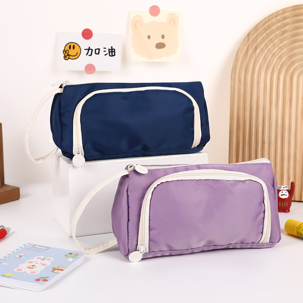 Bolso para lápices con ventana triangular transfronteriza Versión coreana de la caja de papelería de color sólido simple Bolsa de papelería de gran capacidad multifuncional creativa