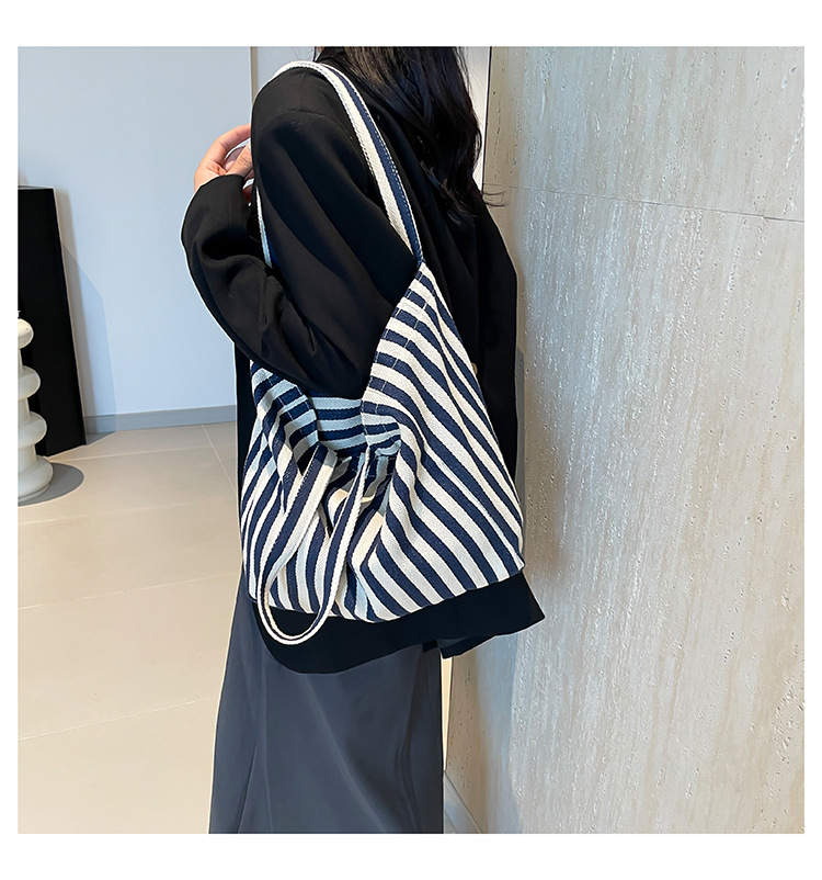 2024 Autumn/Winter new versatile and fashionable striped handbag shopping bag, two-tone large-capacity trendy single-shoulder bag undefined