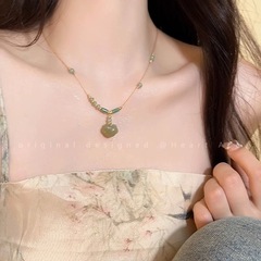 新しい中国式の平安錠の花のネックレスの女性の古風な禅の意の風は縄の鎖の骨のチェーンの親友の贈り物を編みます。