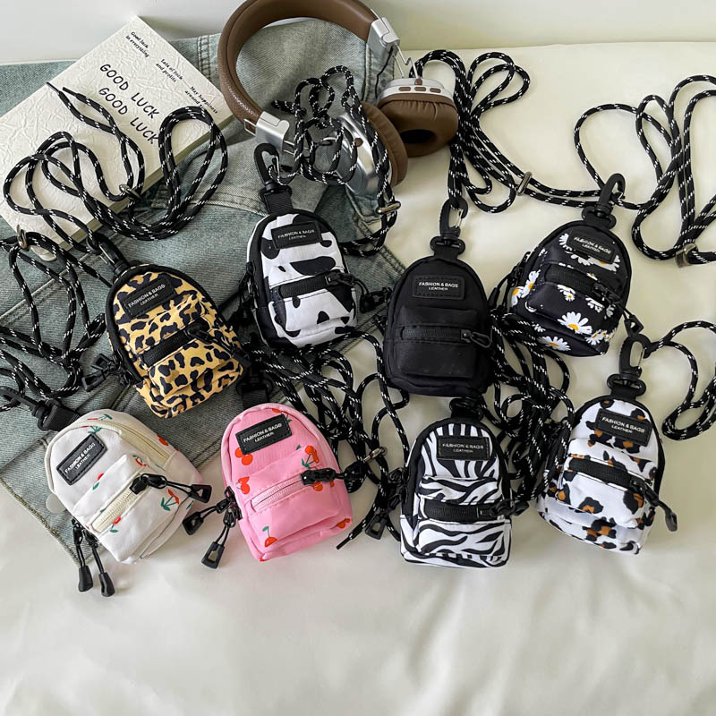 Mini lápiz labial auricular bolsa pequeña 2024 nueva tendencia moda colgante bolso de tela de diseño de nicho bolso de mensajero de un solo hombro