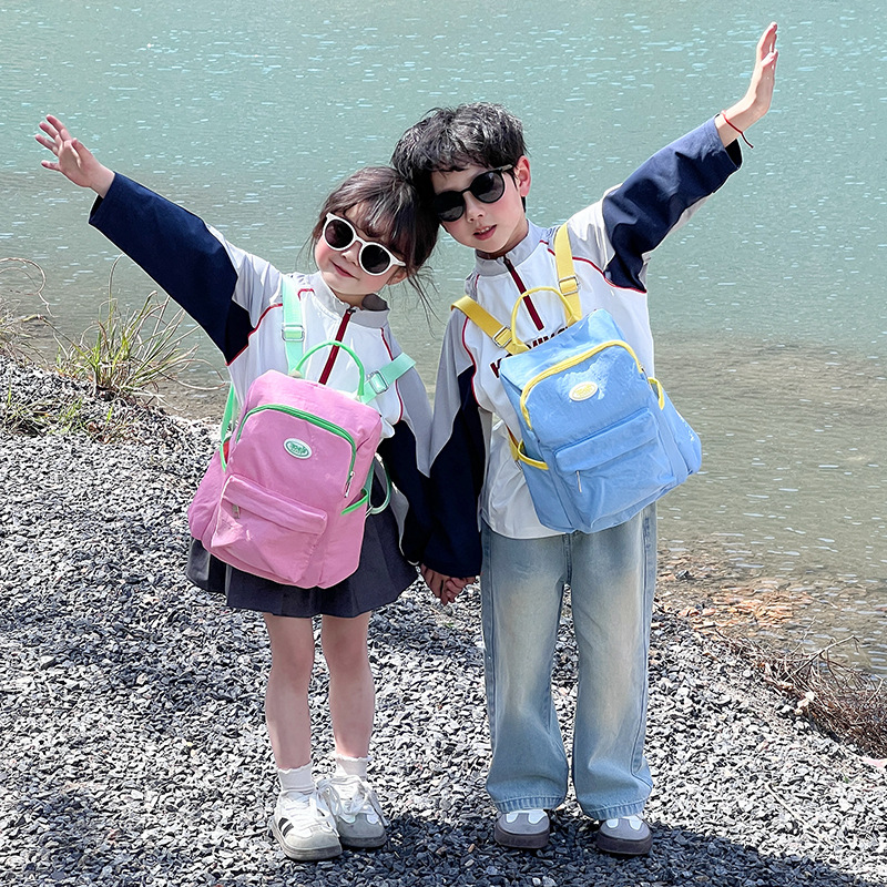 Mochila casual y sencilla para niños y niñas, estilo occidental, lindo color caramelo, mochila escolar para estudiantes de escuela primaria, nueva mochila para niños transfronteriza
