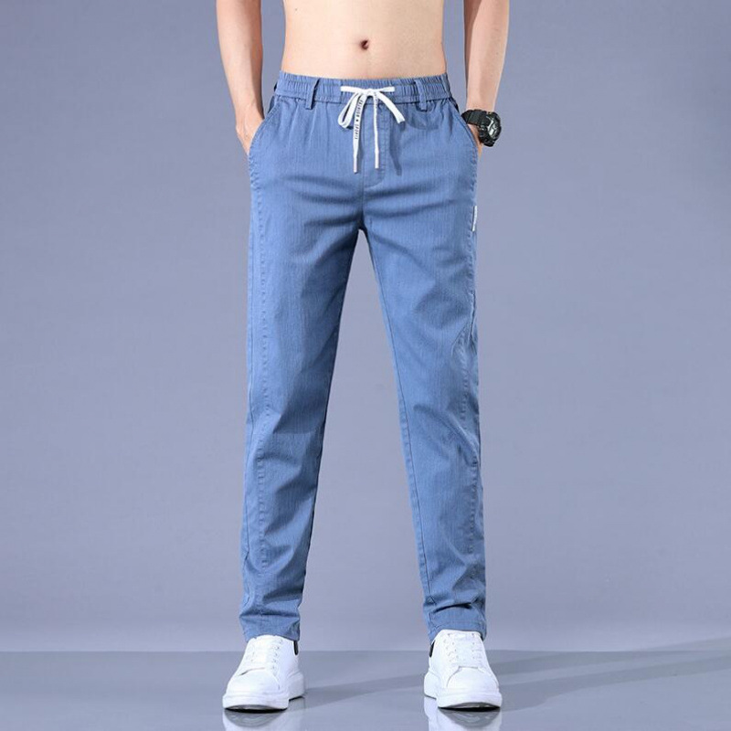 弾力カジュアルパンツ男性用の薄い春夏のひもが腰を緩めています。