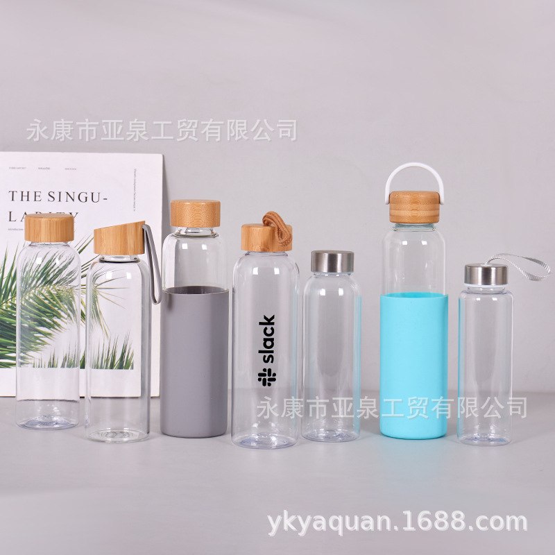 Suministro directo de fábrica Taza de vidrio con tapa de bambú transparente Taza de agua de vidrio de té de oficina de gran capacidad Taza de plástico transparente al por mayor