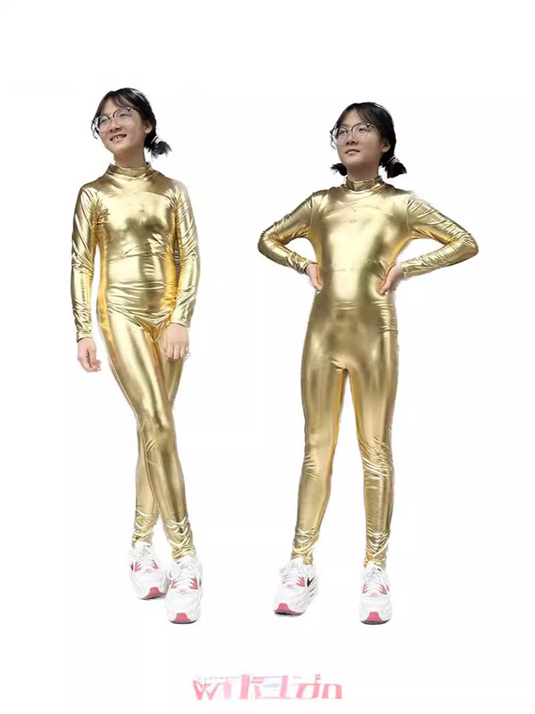 ハロウィーンの子供は金にアイロンをかけてレオタードを塗って頭のないゴムの服の全身の舞台の演技服のアマゾンの服を現します。|undefined