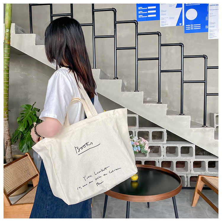 A large-capacity, sturdy Japanese-style canvas bag for women, a new 2022 simple bento handbag for girls to go to work undefined