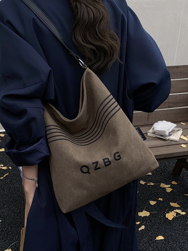 休闲百搭帆布包包女2025新款时尚通勤单肩包大学生外出托特水桶包|undefined