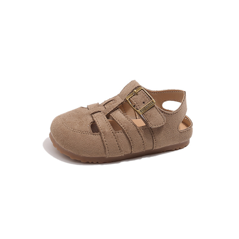 Sandalias romanas huecas para niños 2025 verano nuevo estilo coreano niña plataforma botas de fondo grueso zapatos de playa Baotou para niños
