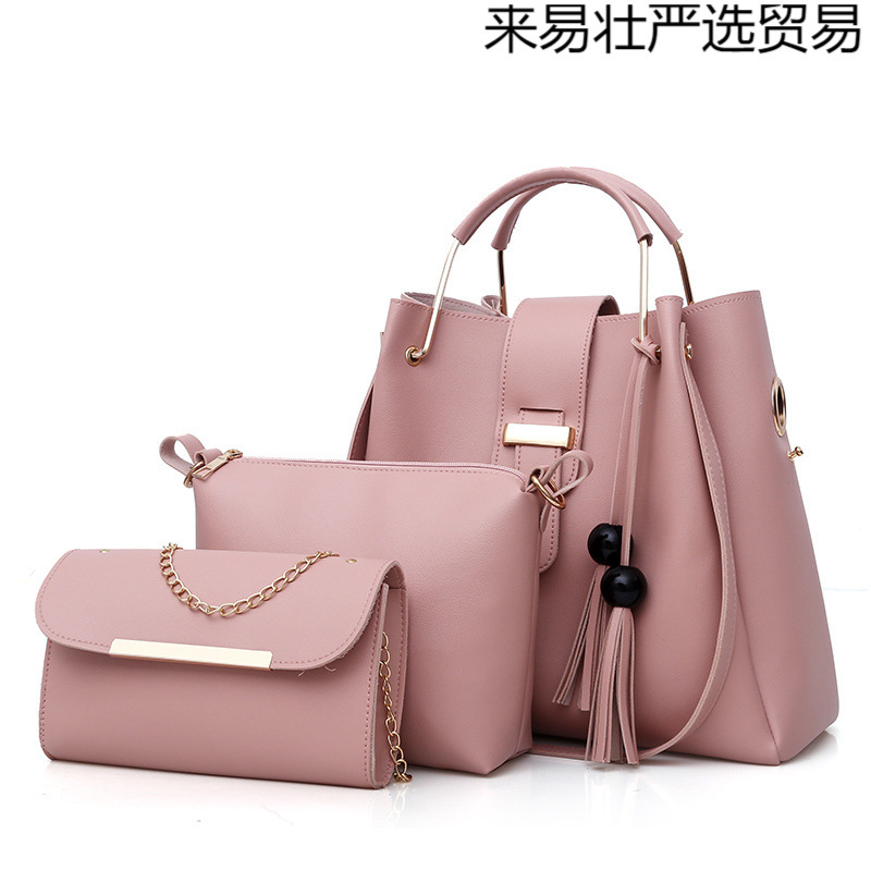 Primavera y verano nuevo estilo bolso de mensajero femenino bolso de moda para niños y madres bolso de hombro de todo fósforo bolso de cubo con borlas de gran capacidad nuevo