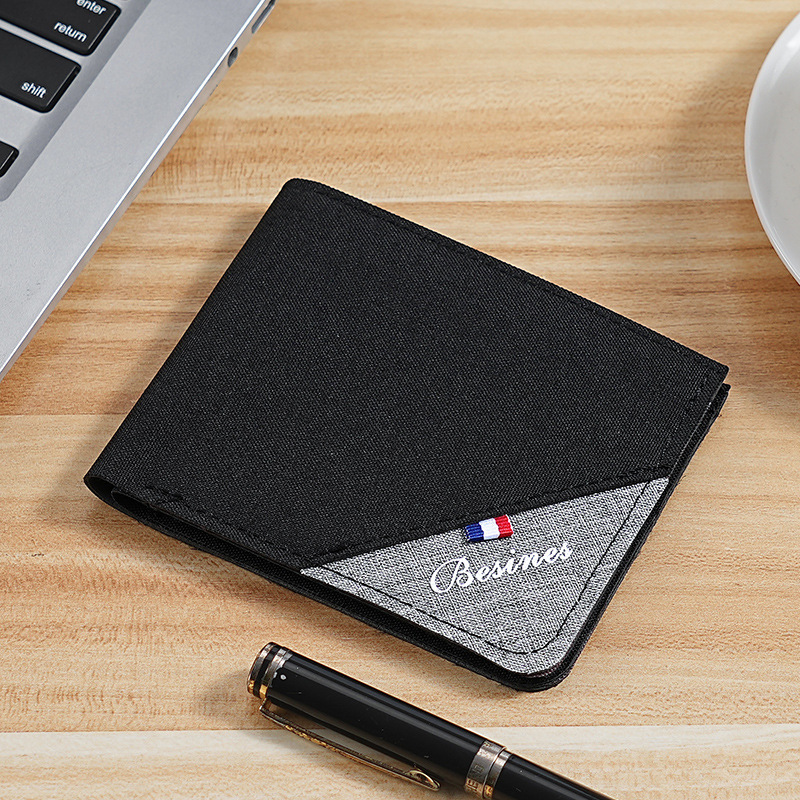 Cartera de color en contraste para hombre corta 2025 nueva marca de moda joven estudiante personalidad simple clip de camioneta plegable ultrafino