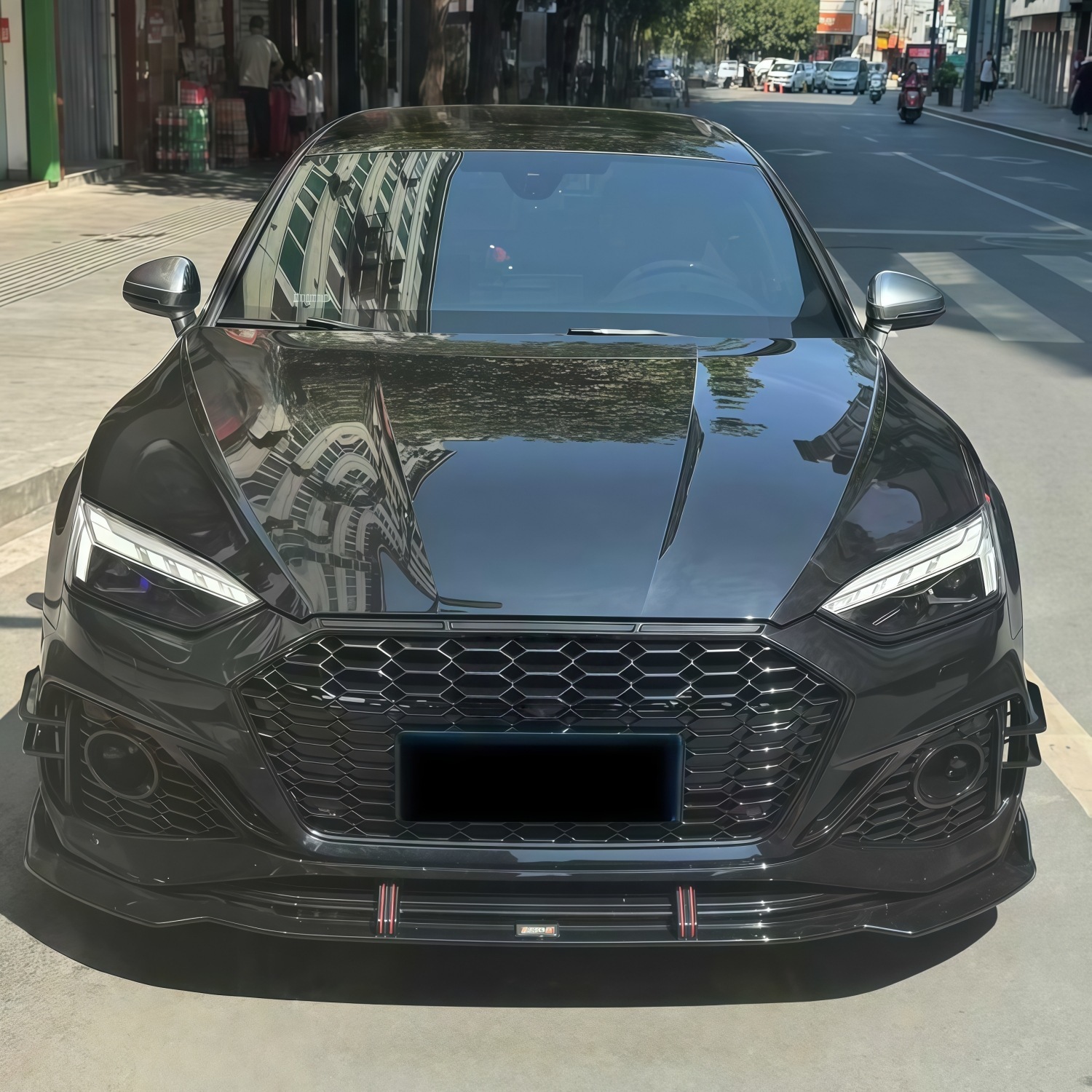 Suitable for Audi A5 2021-2024 models, RS5 rear bumper assembly, rear surround, tail lip, tail throat, and rear lower skirt, in a black finish