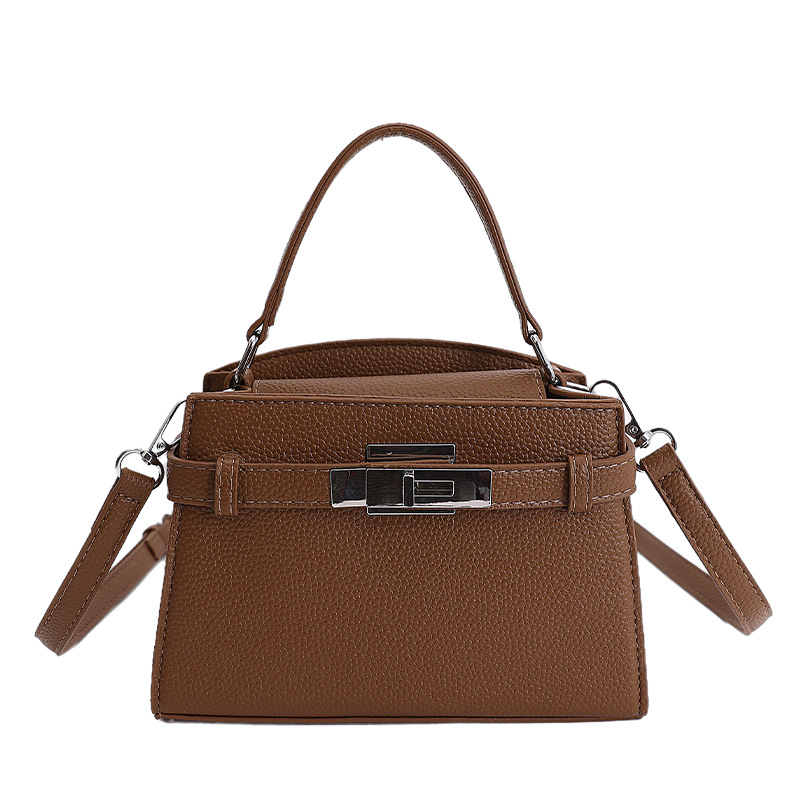 Bolso de mano de alto nivel de estilo occidental para mujeres 2026 nuevo retro nicho Kelly bolsa de viaje universal mochila de hombro